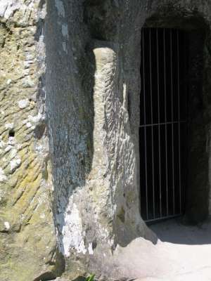 old statue at entrance to grotto